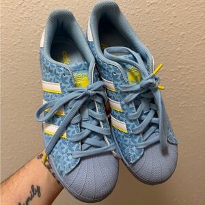 adidas Light Blue Floral Shelltoe Sneakers with White Stripes and Yellow Accents